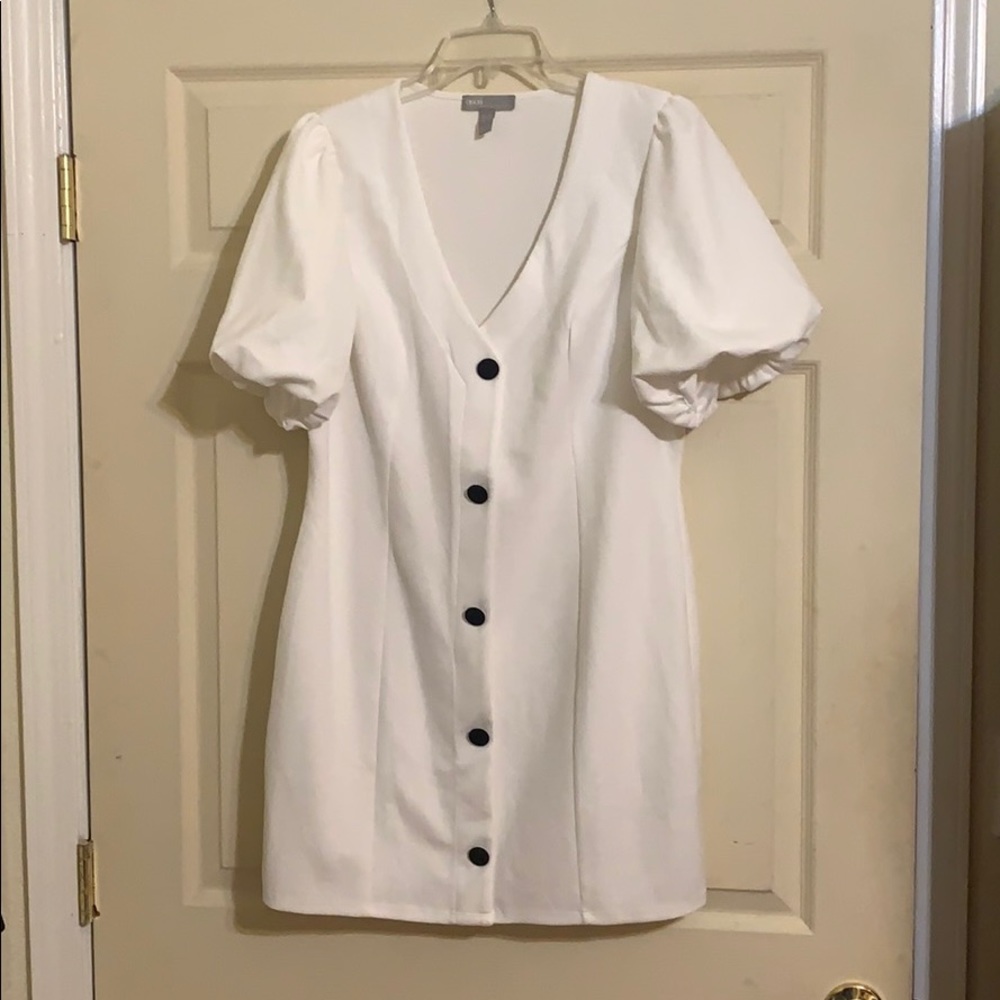 White mini dress with puffed sleeves